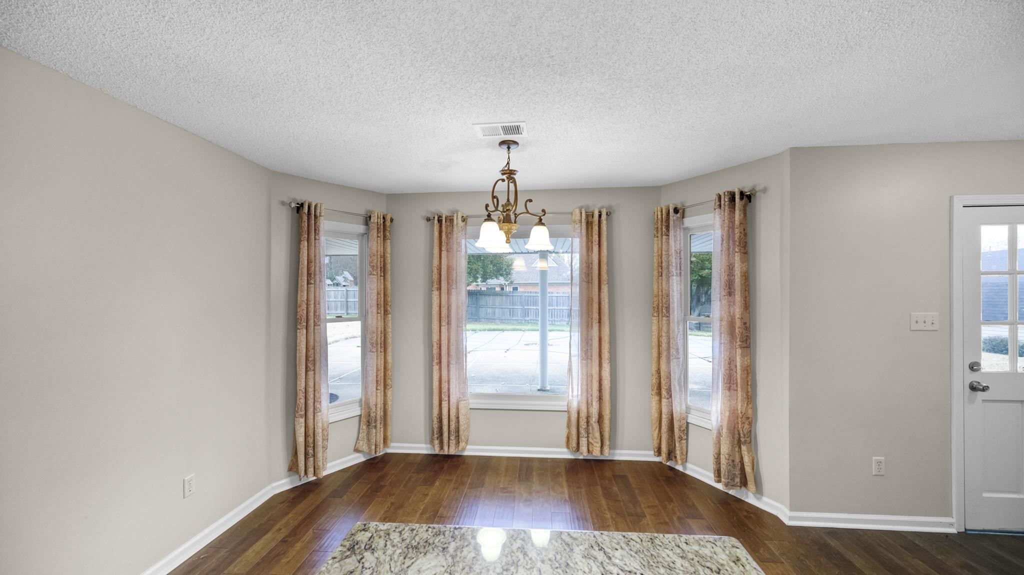 1105 Winrose Drive Collierville, TN 38017 - Photo 20 of 37 a view of livingroom with hardwood floor and window