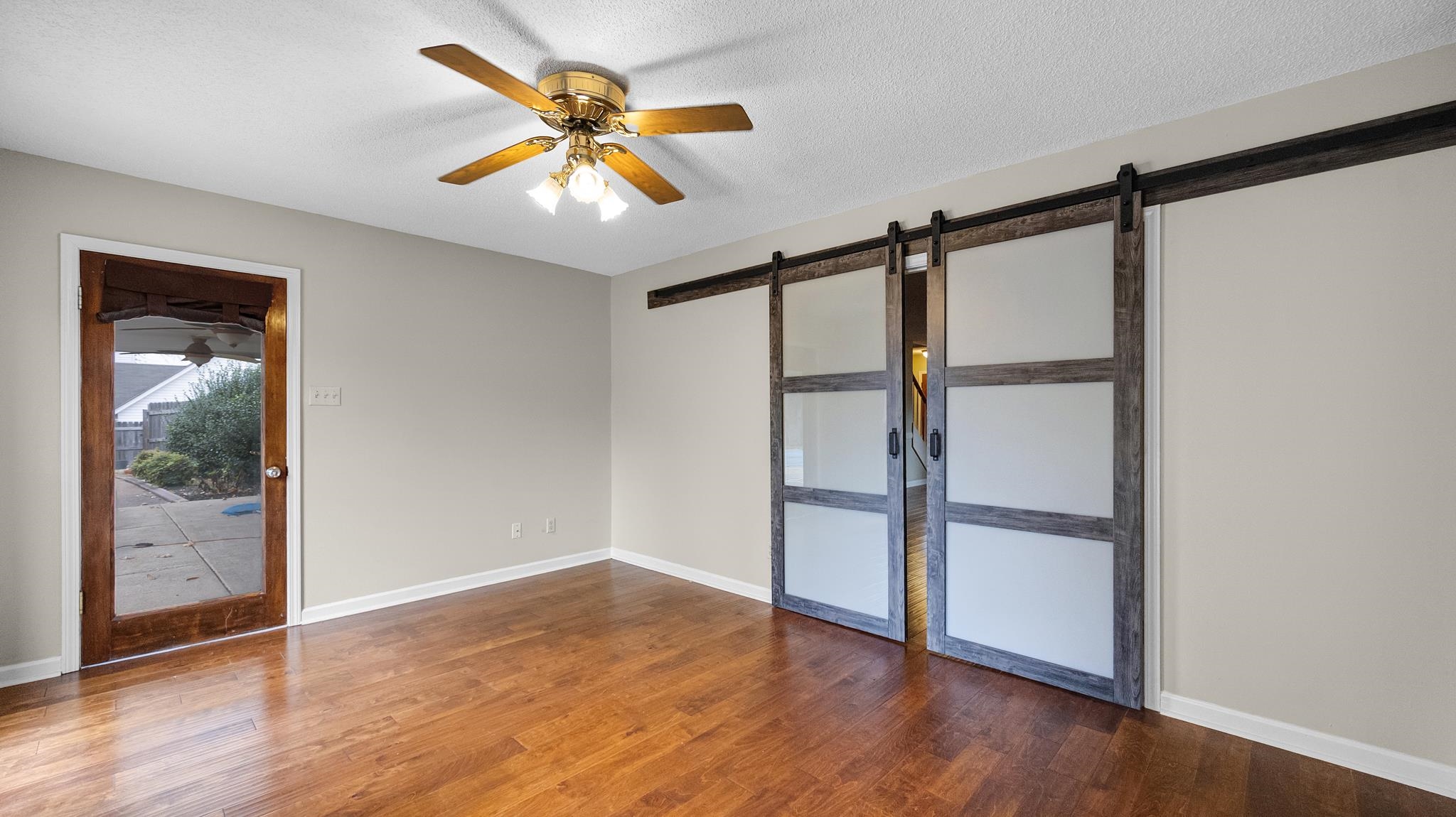 1105 Winrose Drive Collierville, TN 38017 - Photo 10 of 37 wooden floor in an empty room with a window
