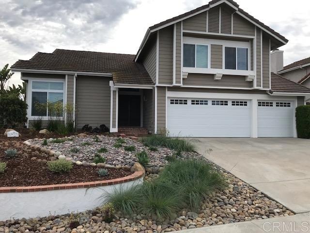1917 Wandering Road Encinitas, CA 92024 - Photo 24 of 24 a front view of a house with garden