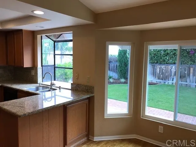 a kitchen with a sink and a window
