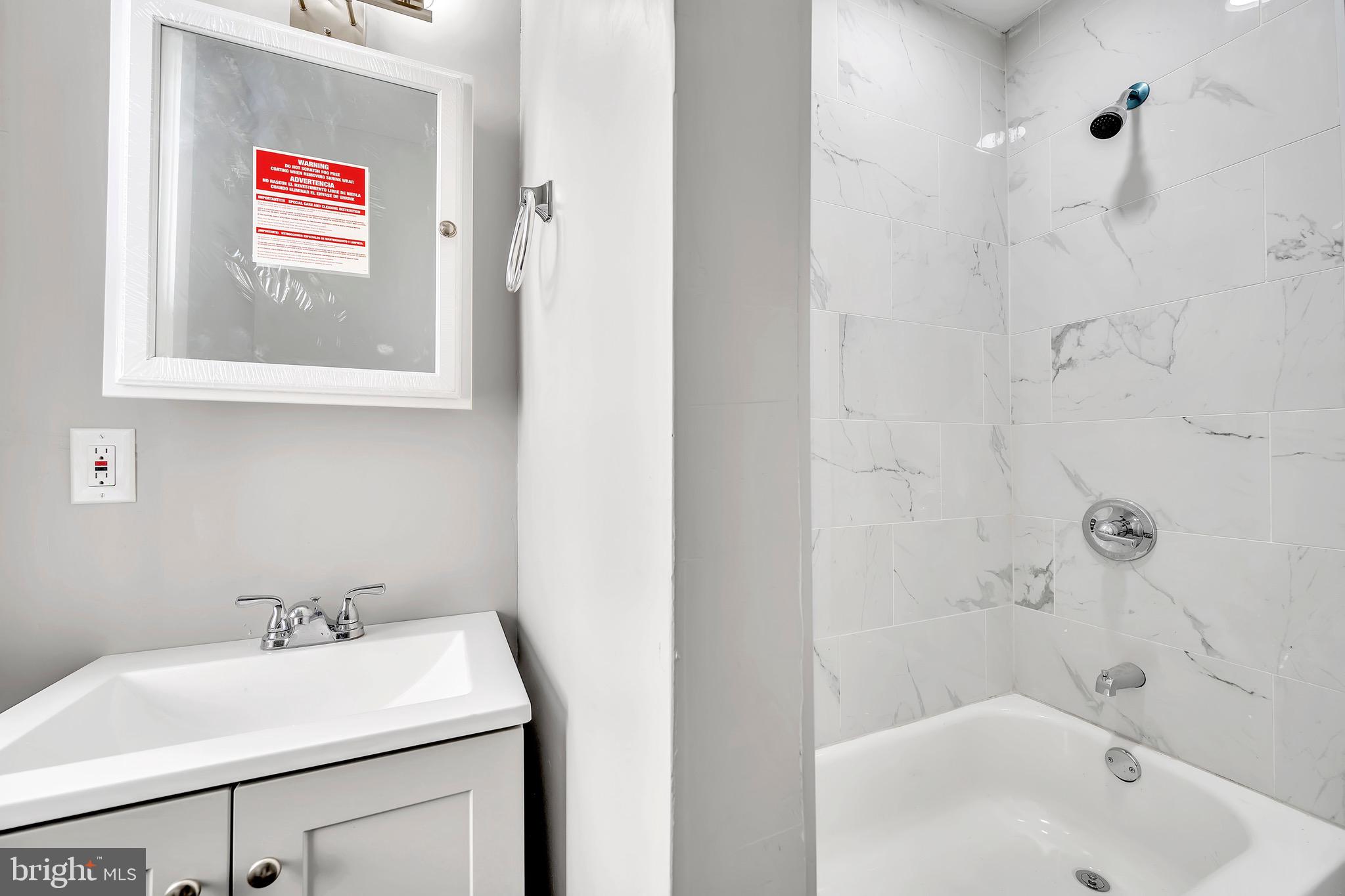 25 Adella Avenue Hamilton, NJ 08609 - Photo 14 of 15 a bathroom with a sink and a bathtub