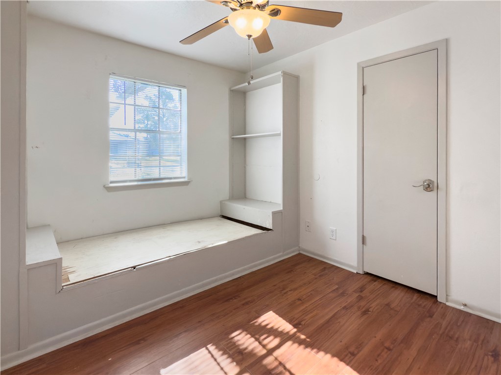 3003 Highwood Lane Bryan, TX 77803 - Photo 20 of 21 a view of empty room with wooden floor and fan
