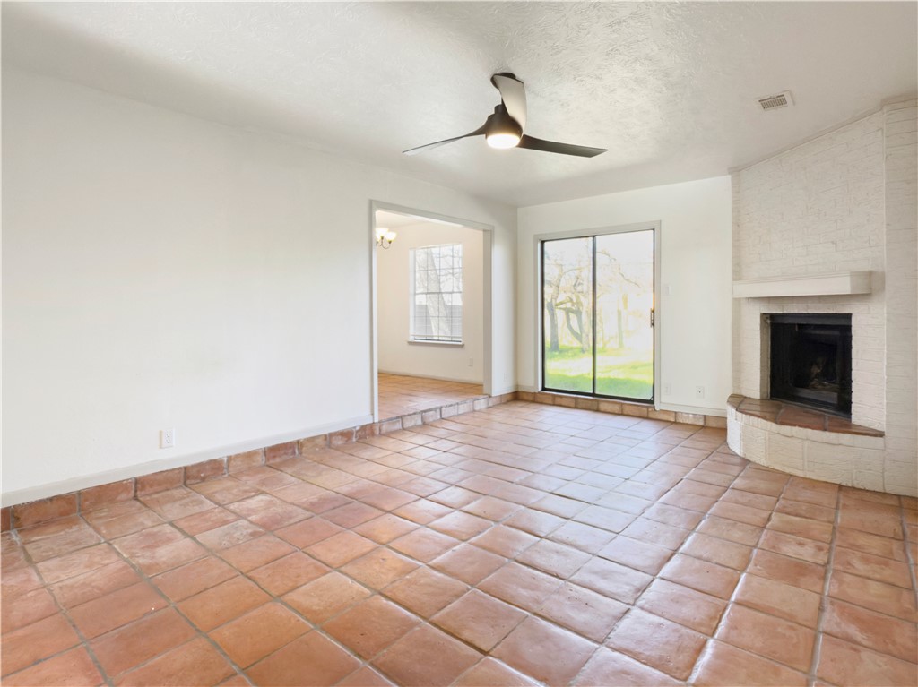 3003 Highwood Lane Bryan, TX 77803 - Photo 3 of 21 a view of an empty room with window and chandelier fan