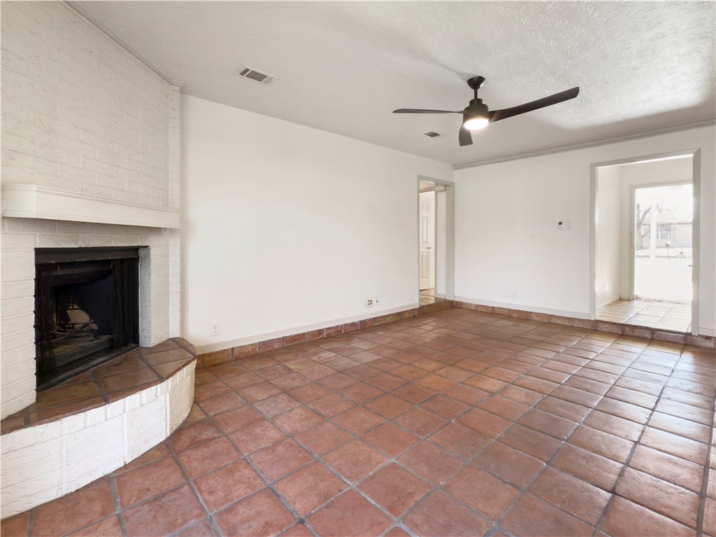 3003 Highwood Lane Bryan, TX 77803 - Photo 4 of 21 a view of an empty room with window and fireplace