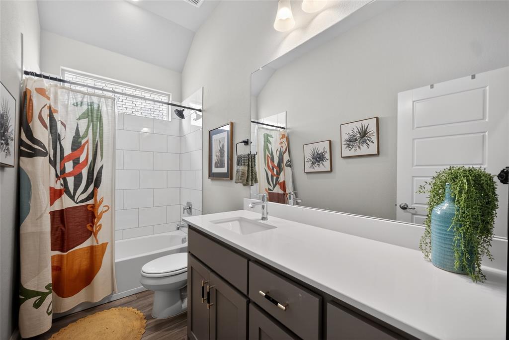2252 Knightsgate Road Argyle, TX 76226 - Photo 22 of 36 Full bathroom featuring vanity, shower / bath combo, and dark wood-style flooring