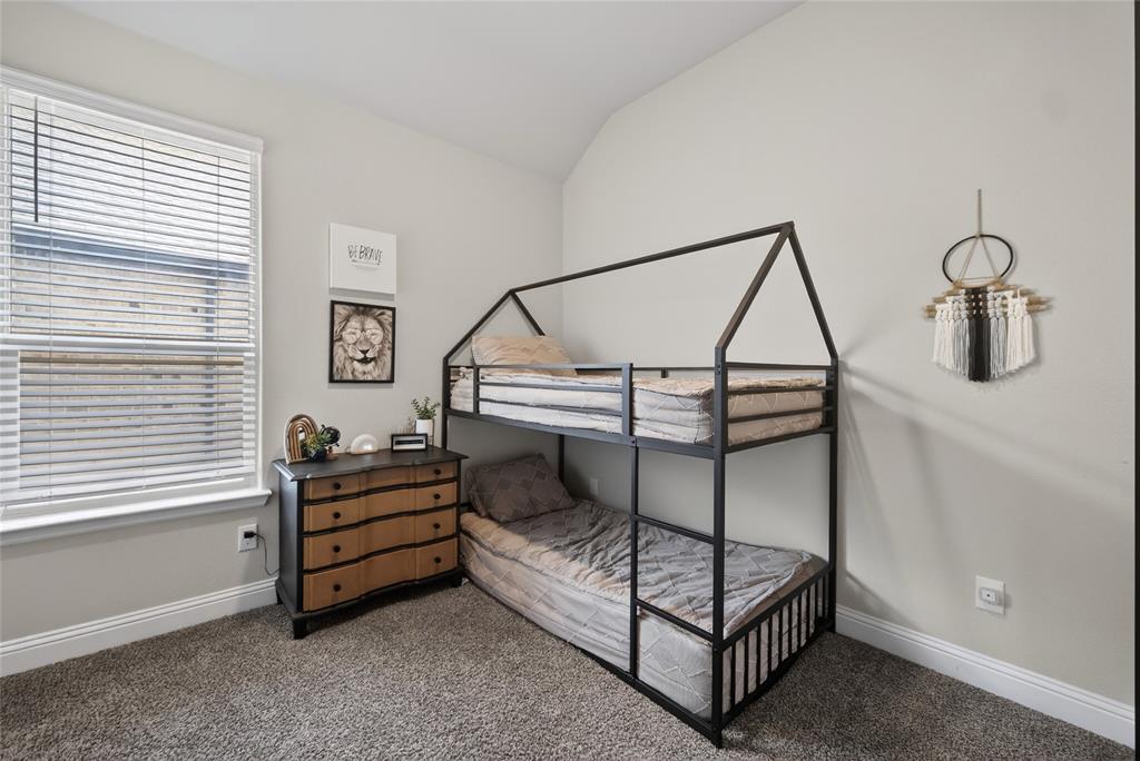 2252 Knightsgate Road Argyle, TX 76226 - Photo 23 of 36 Carpeted bedroom with baseboards and vaulted ceiling