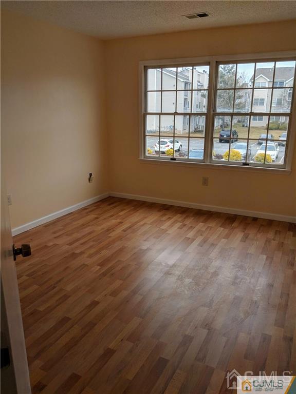 1223 Edpas Road, Unit 1223 New Brunswick, NJ 08901 - Photo 8 of 18 a view of an empty room with a window