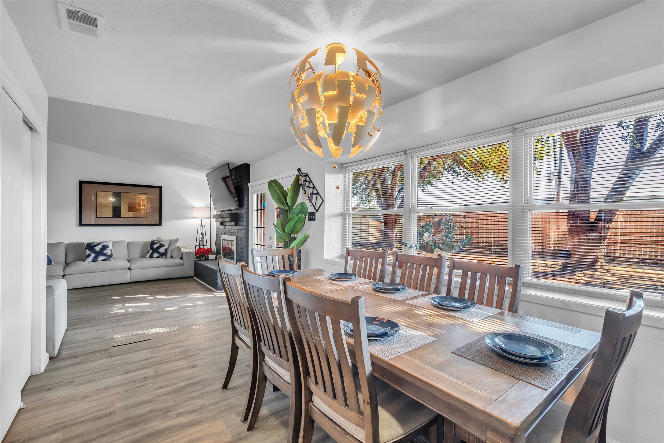 3435 Acorn Springs Lane Spring, TX 77389 - Photo 12 of 23 a view of a dining room with furniture a chandelier and wooden floor