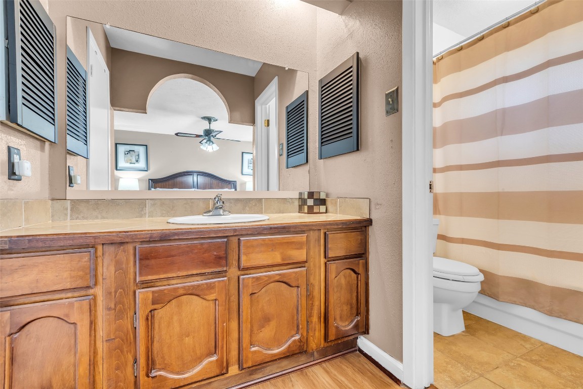 3435 Acorn Springs Lane Spring, TX 77389 - Photo 15 of 23 a bathroom with a sink mirror vanity and toilet