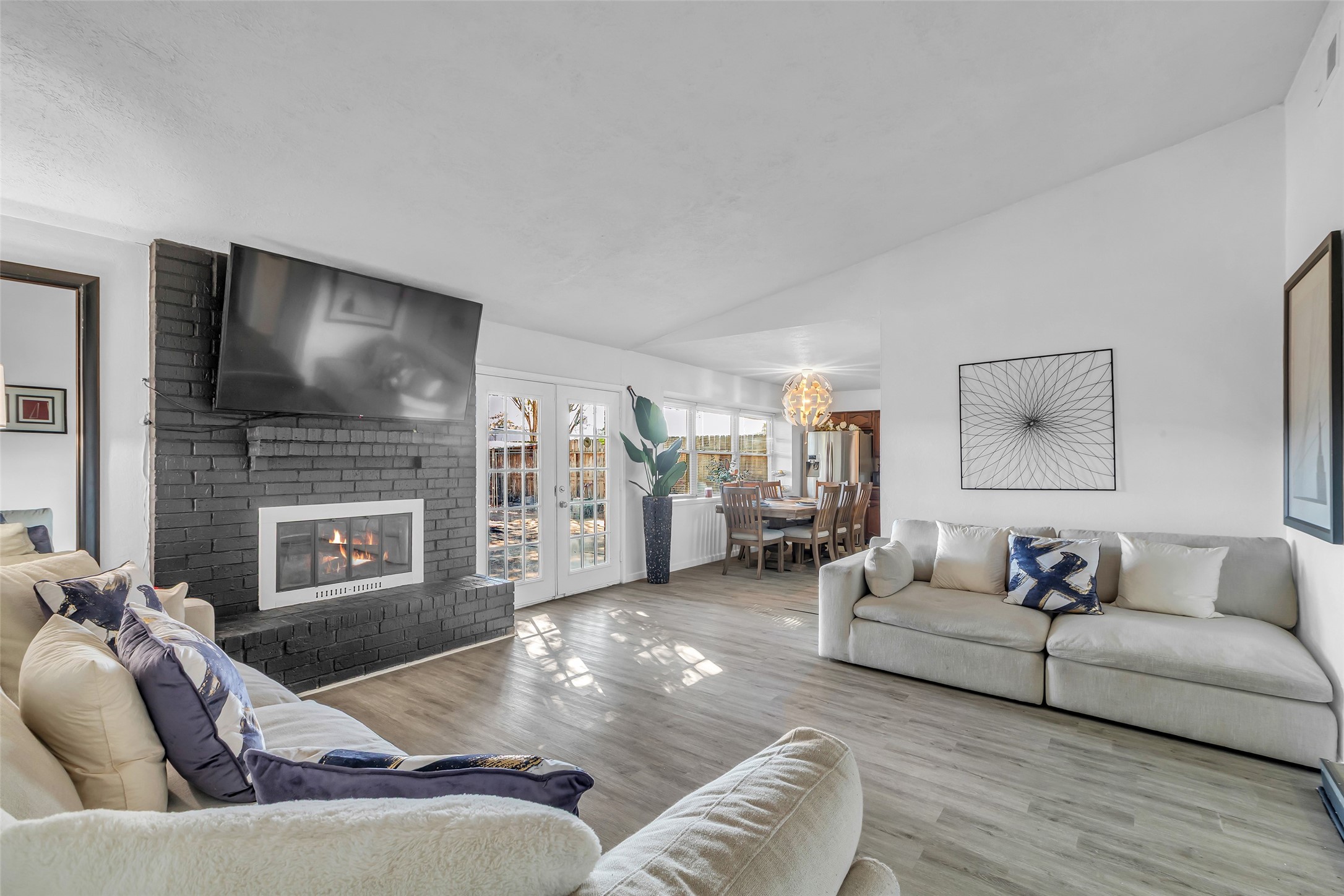 3435 Acorn Springs Lane Spring, TX 77389 - Photo 9 of 23 a living room with furniture fireplace and a flat screen tv