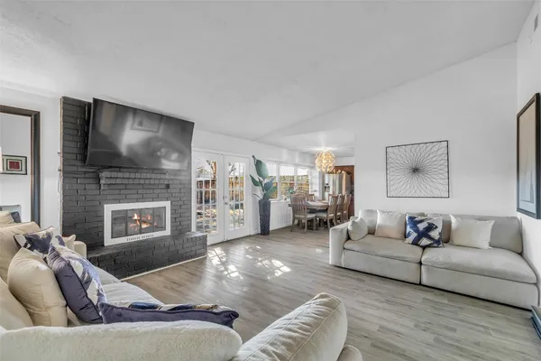 a living room with furniture fireplace and a flat screen tv