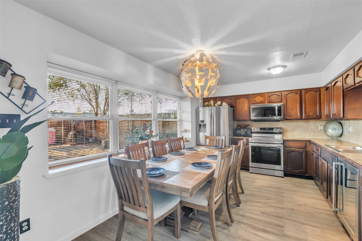 3435 Acorn Springs Lane Spring, TX 77389 - Photo 10 of 23 a view of a dining room with furniture large window and wooden floor