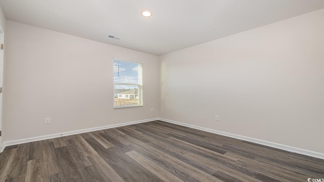 3433 Ashridge Way Conway, SC 29526 - Photo 23 of 31 Empty room with dark hardwood / wood-style floorin