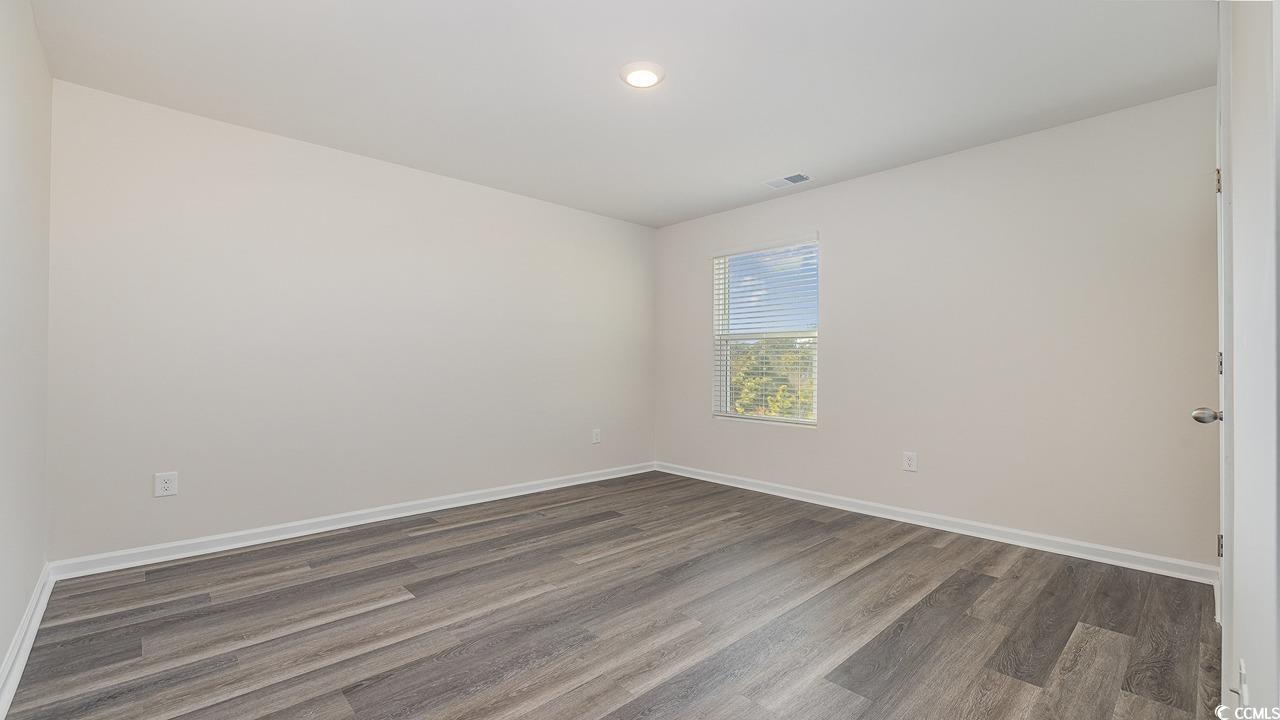 3433 Ashridge Way Conway, SC 29526 - Photo 26 of 31 Empty room featuring dark wood-type flooring