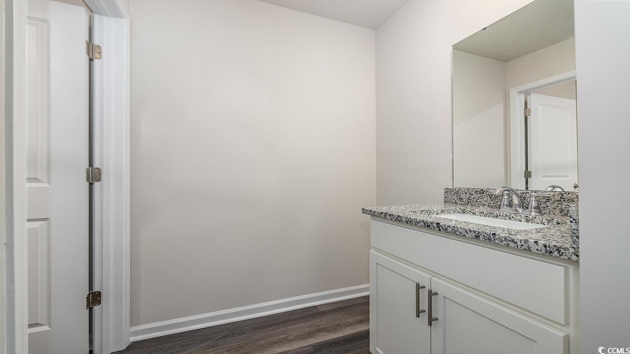 3433 Ashridge Way Conway, SC 29526 - Photo 27 of 31 Bathroom with hardwood / wood-style flooring and v