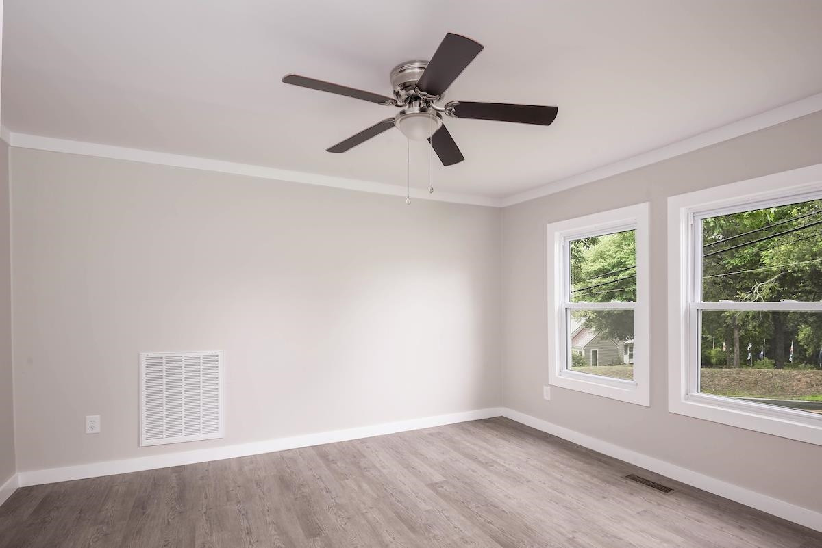 314 Depot Street Roxboro, NC 27573 - Photo 13 of 35 a view of an empty room with a window