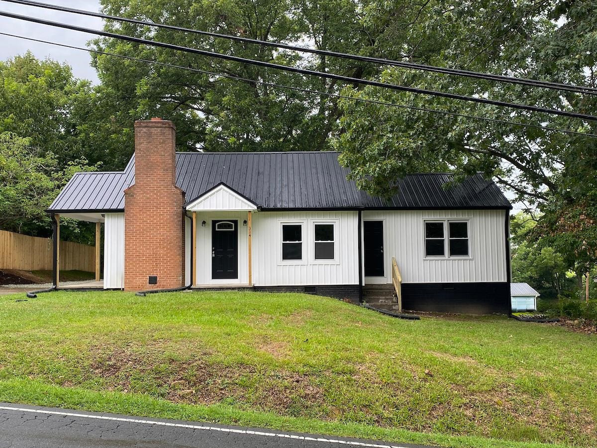 314 Depot Street Roxboro, NC 27573 - Photo 2 of 35 a view of a house with a yard