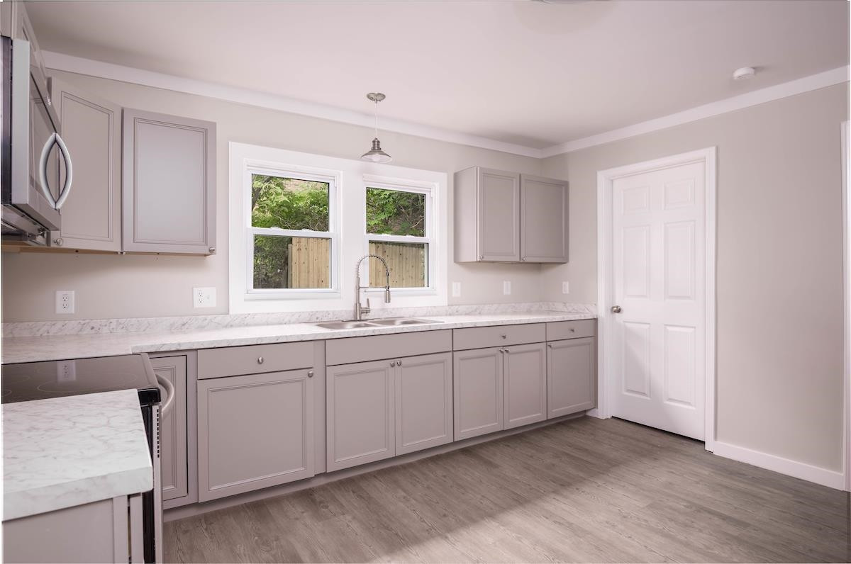 314 Depot Street Roxboro, NC 27573 - Photo 9 of 35 a kitchen with sink cabinets and window