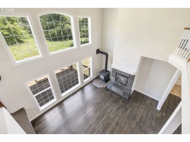 a view of living room with furniture and floor to ceiling windows