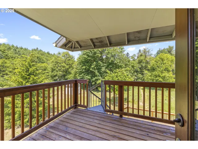 a view of balcony with wooden floor