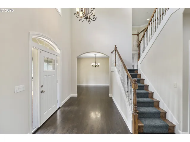 a view of an entryway with wooden floor