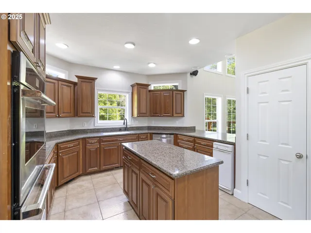 a kitchen with a stove a sink and a refrigerator