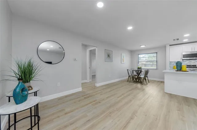 a view of a livingroom with furniture and a potted plant