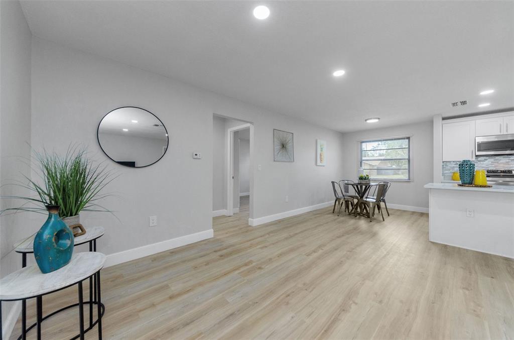 12920 Walnut Tree Lane Hudson, FL 34669 - Photo 19 of 35 a view of a livingroom with furniture and a potted plant