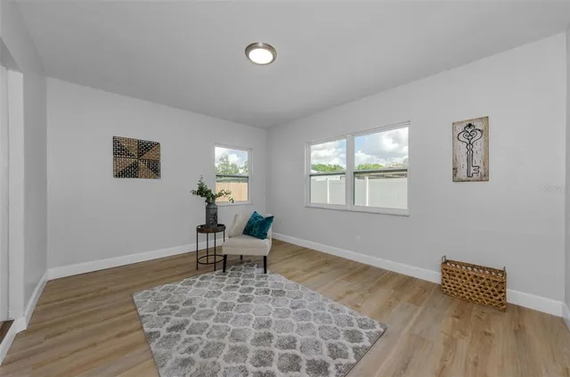 a living room with furniture and a window
