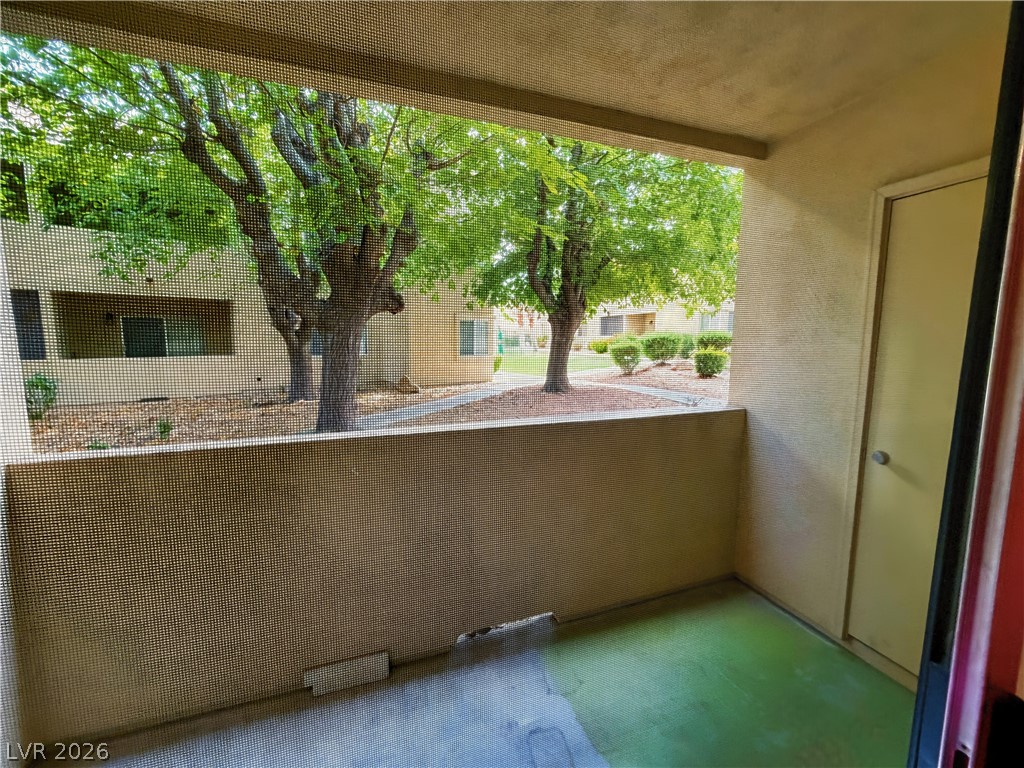 1852 North Decatur Boulevard, Unit 101 Las Vegas, NV 89108 - Photo 25 of 45 Mature green trees frame the view from this private outdoor balcony space.