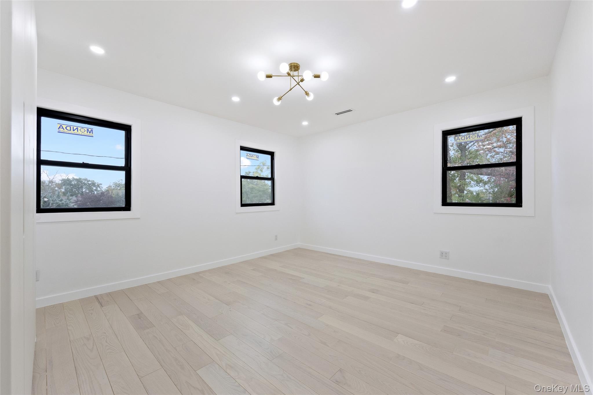 157-03 Locke Avenue Queens, NY 11357 - Photo 16 of 24 a view of an empty room with a window