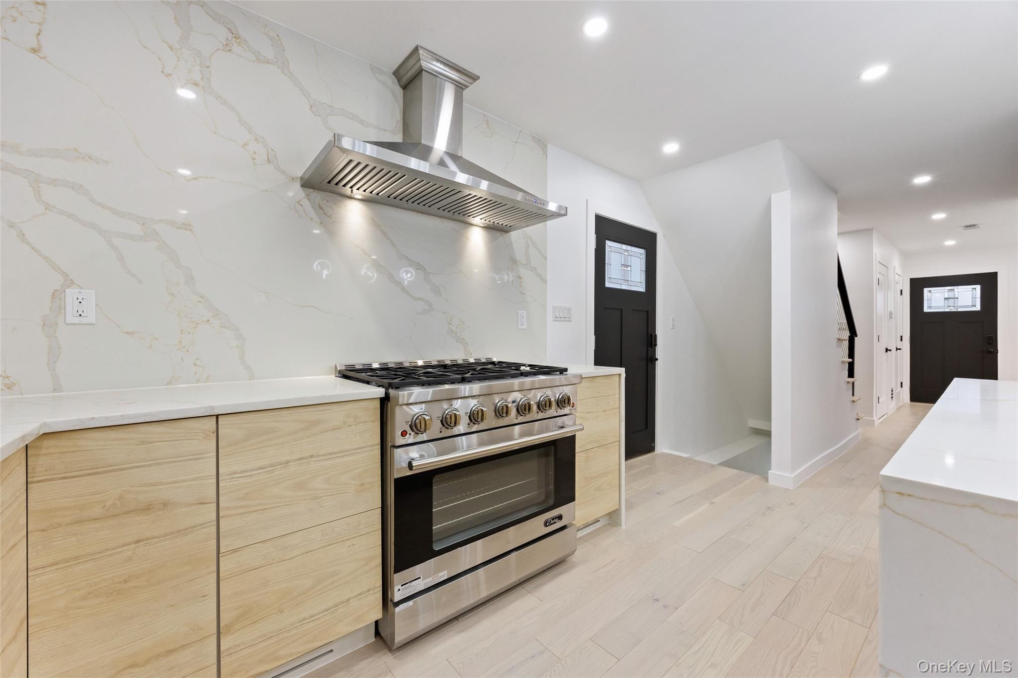 157-03 Locke Avenue Queens, NY 11357 - Photo 5 of 24 a stove top oven sitting inside of a kitchen