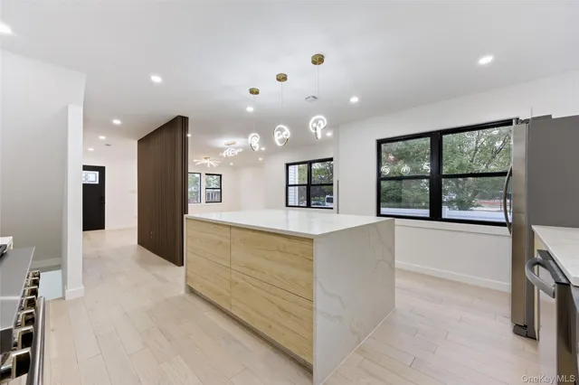 a large bathroom with a large tub and shower