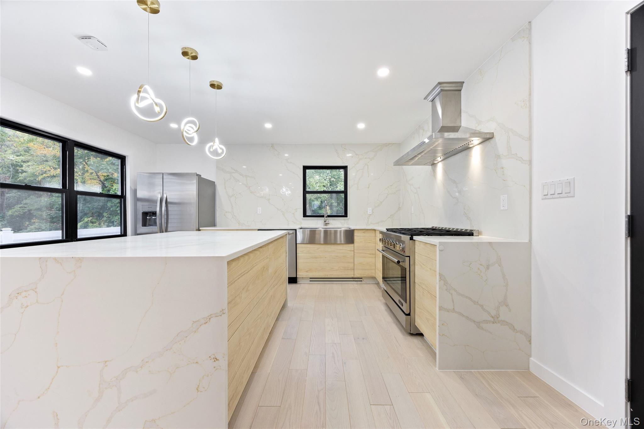 157-03 Locke Avenue Queens, NY 11357 - Photo 8 of 24 a large white kitchen with a large window