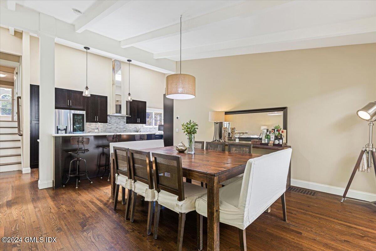 70 Gregory Road Cos Cob, CT 06807 - Photo 6 of 39 a view of a dining room with furniture wooden floor and chandelier