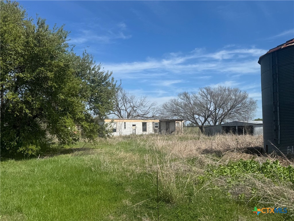 224 5th Street Burlington, TX 76519 - Photo 2 of 8 a view of a yard with an outdoor space