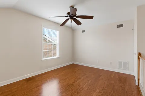 a view of room with wooden floor