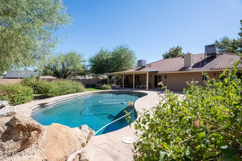 a view of a house with swimming pool