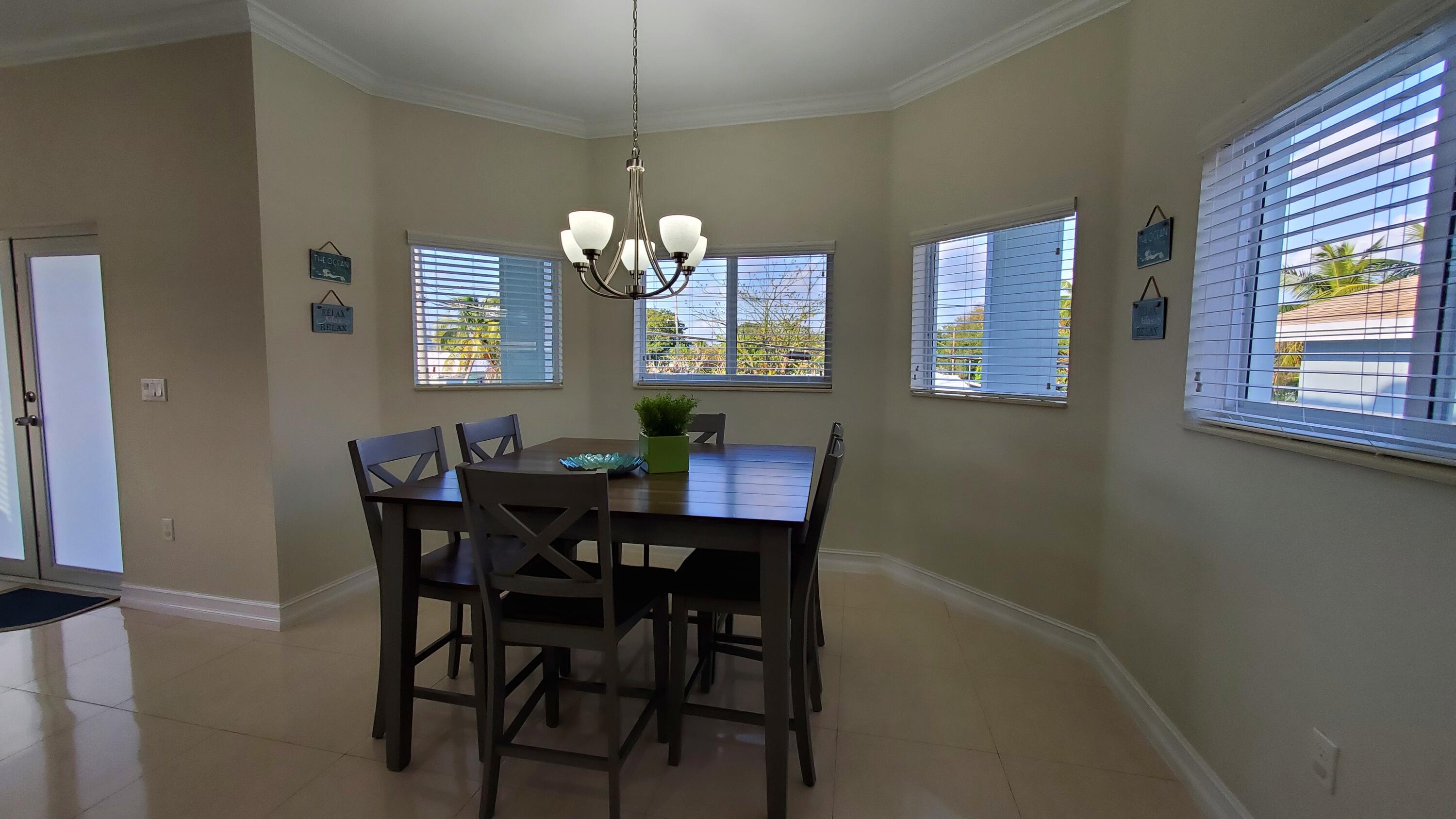30 Coconut Drive Key Largo, FL 33037 - Photo 14 of 39 a view of a dining room with furniture and window
