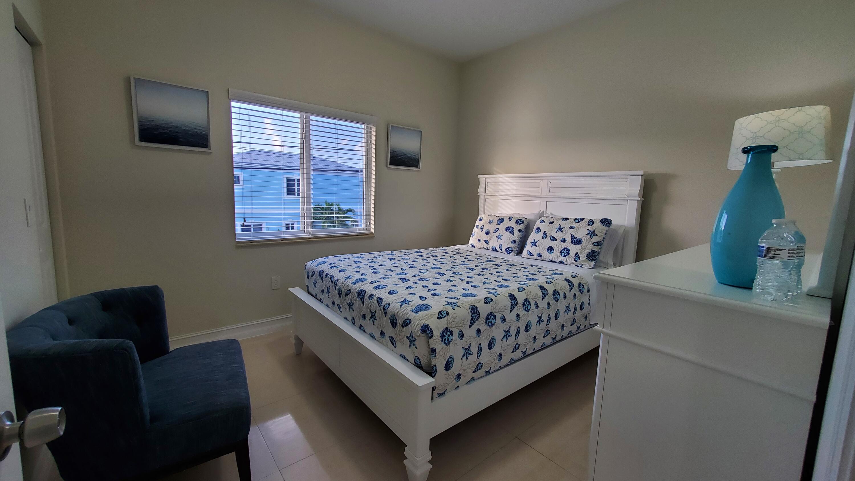 30 Coconut Drive Key Largo, FL 33037 - Photo 15 of 39 a bedroom with a bed window and a couch