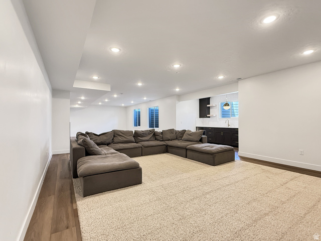 916 Rocky Mountain Way Elk Ridge, UT 84651 - Photo 43 of 54 Living area featuring wood finished floors and recessed lighting