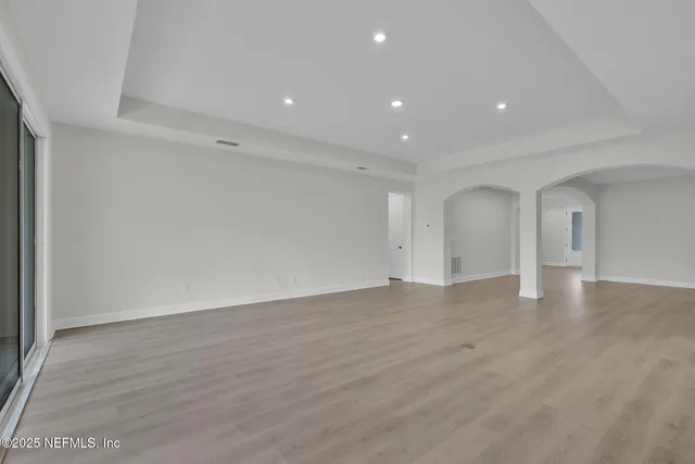 a kitchen with stainless steel appliances a sink stove and cabinets
