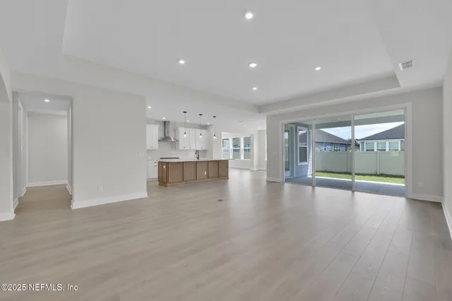 a view of kitchen with wooden floor