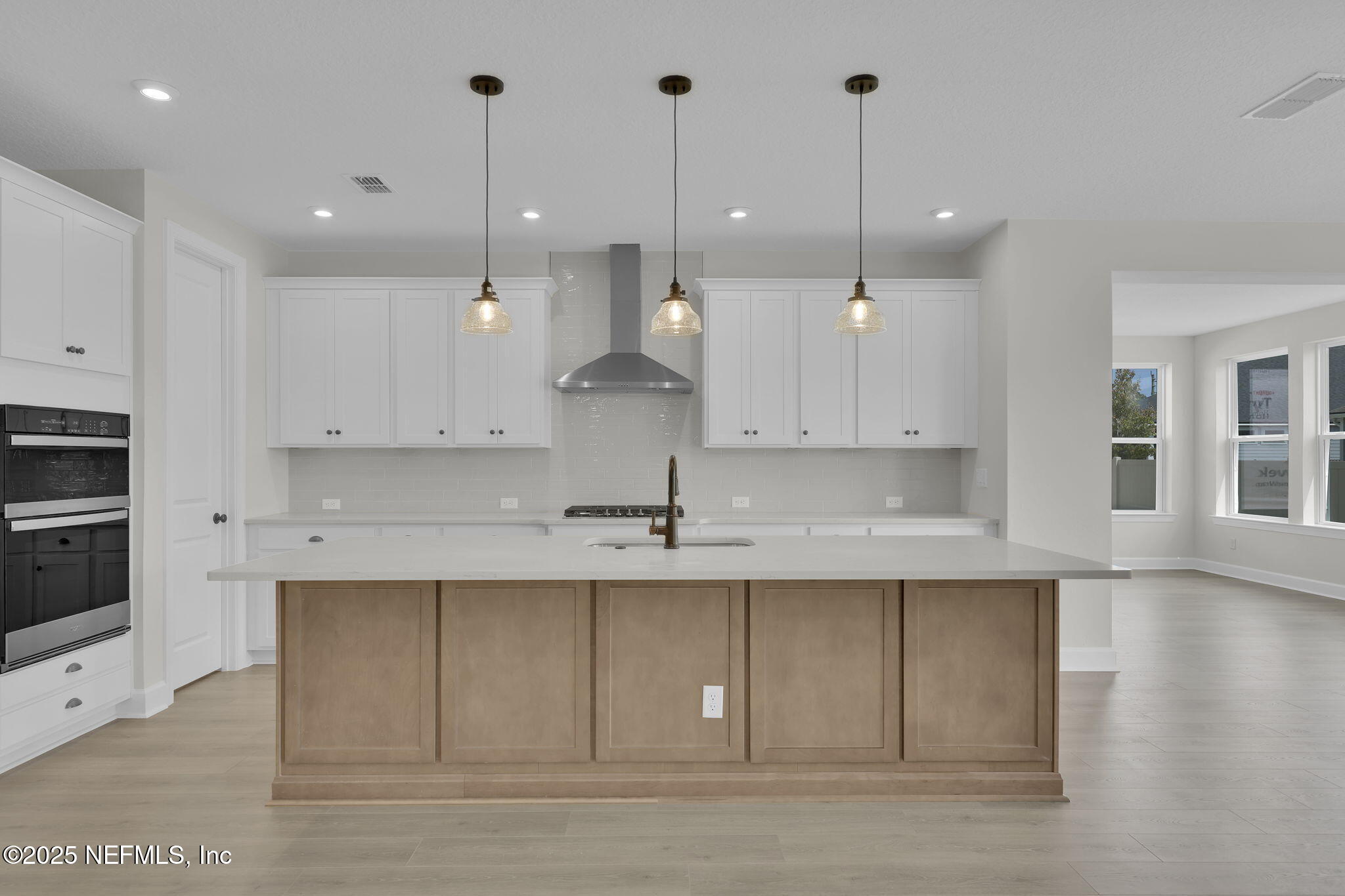 80 Oak Cluster Lane St. Augustine, FL 32092 - Photo 20 of 53 a view of a kitchen with kitchen island a sink stainless steel appliances and cabinets