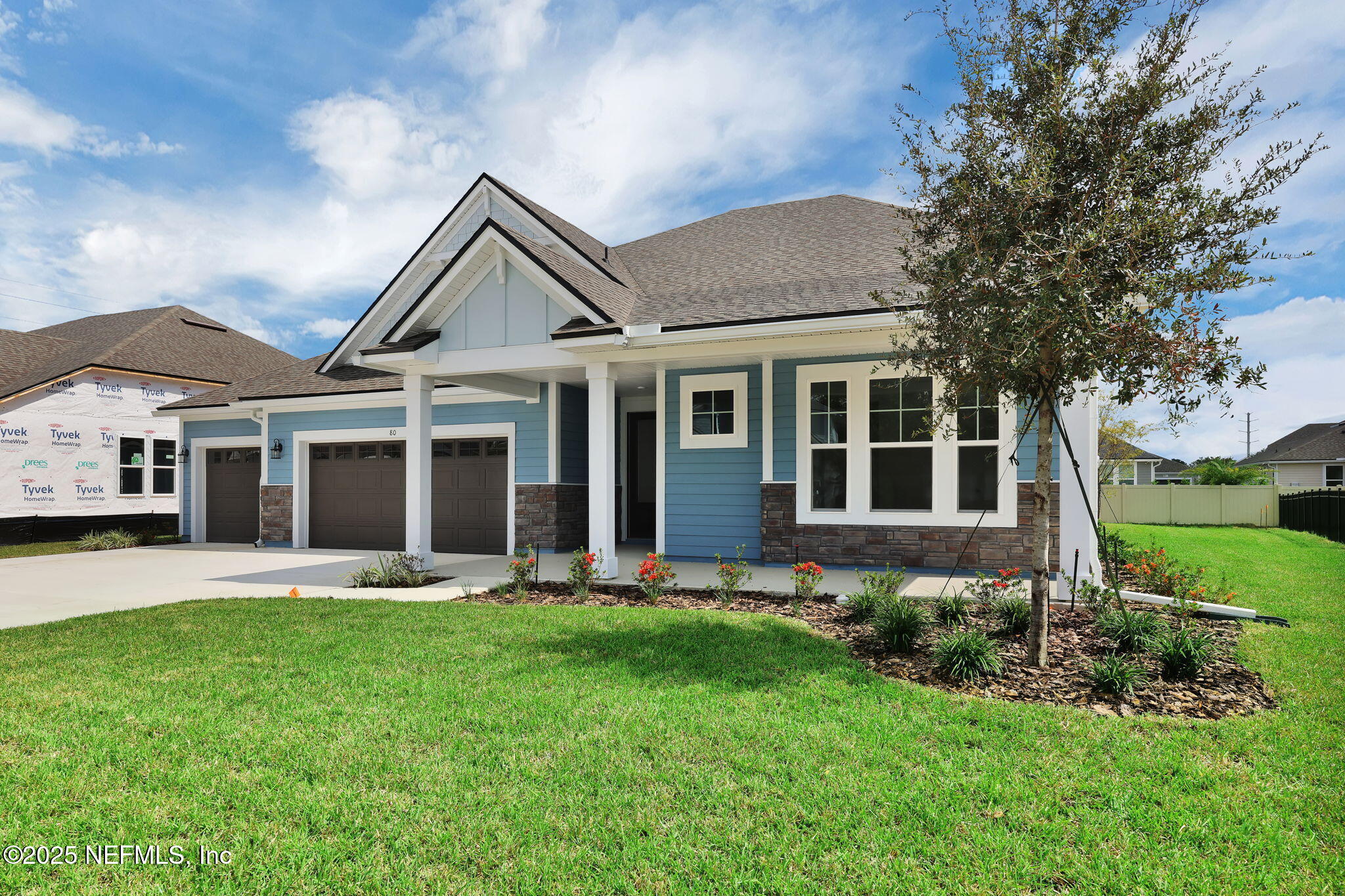 80 Oak Cluster Lane St. Augustine, FL 32092 - Photo 2 of 53 a front view of a house with a yard and plants
