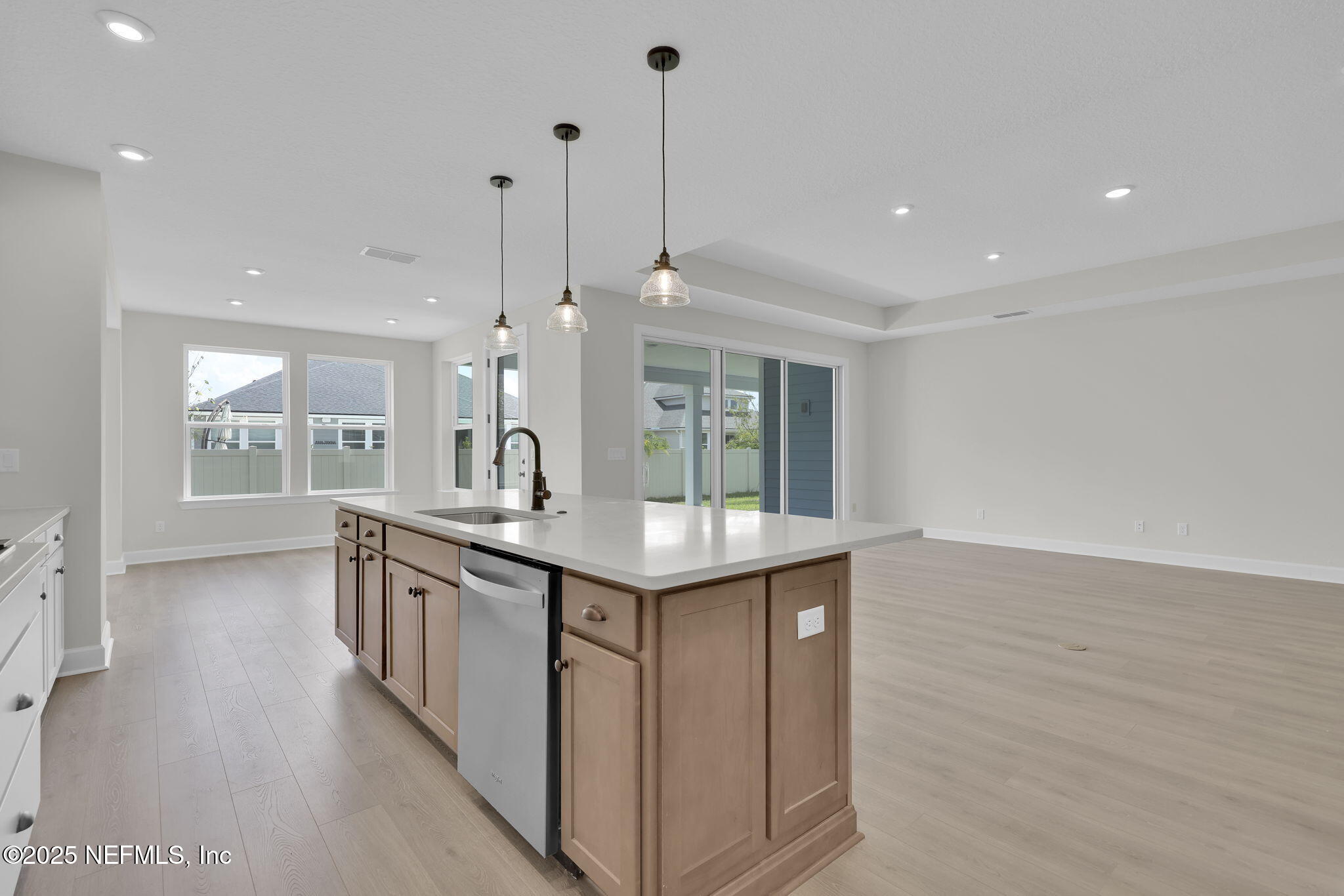 80 Oak Cluster Lane St. Augustine, FL 32092 - Photo 22 of 53 a kitchen with stainless steel appliances granite countertop a sink a stove and a wooden floor