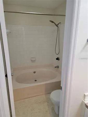 a bathroom with a shower and a toilet