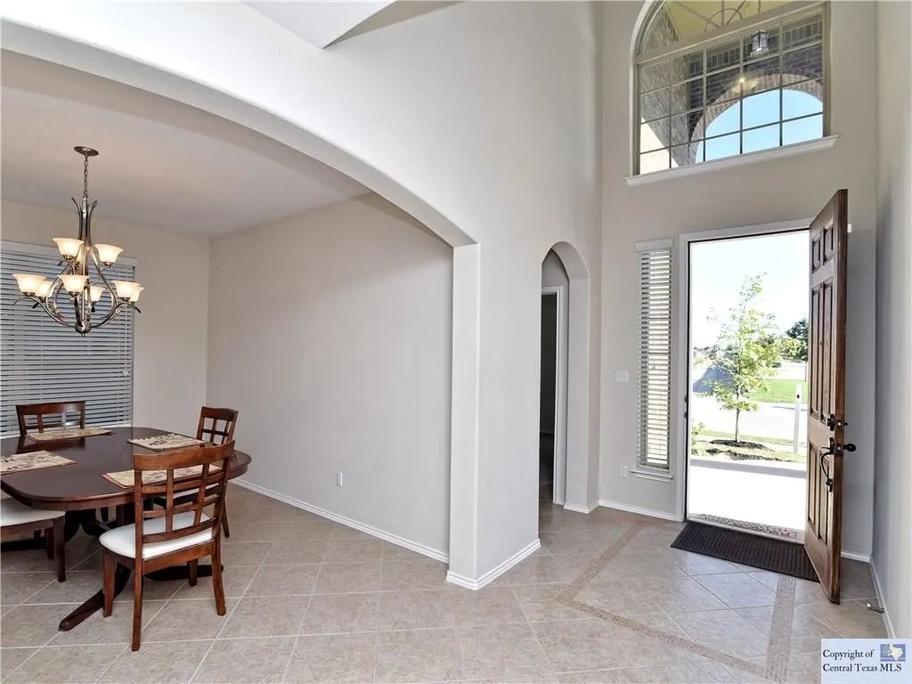 3029 Jacob Lane San Marcos, TX 78666 - Photo 17 of 24 a view of a dining room with furniture and a chandelier