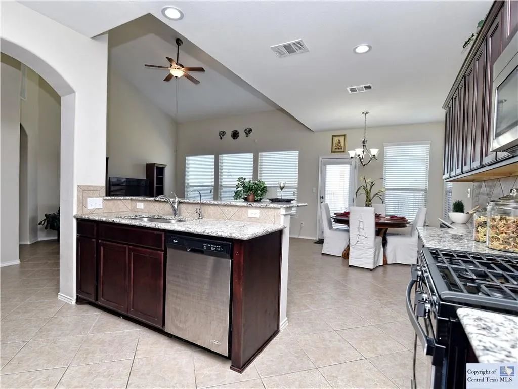 3029 Jacob Lane San Marcos, TX 78666 - Photo 2 of 24 a kitchen with a sink counter top space appliances and cabinets