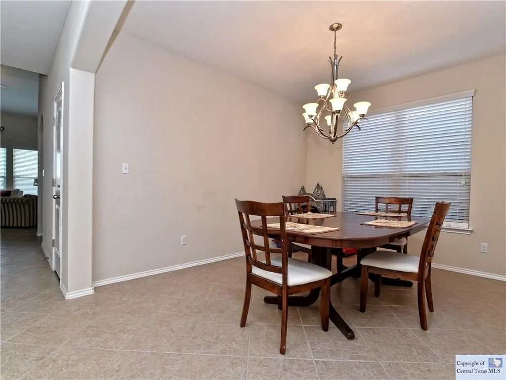 3029 Jacob Lane San Marcos, TX 78666 - Photo 21 of 24 a view of a dining room with a table and chairs